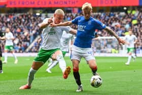 Ross McCausland and Lewis Miller battle for the ball the last time the two sides clashed at Ibrox. Cr: SNS Group.