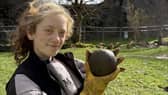 Magnet Fishing Edinburgh's Eryn and the 350-year-old cannonball found in the River Lochy in the Scottish Highlands. 