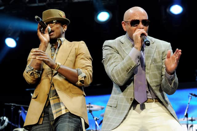 Ne-Yo and Pitbull performing together in 2011. 
