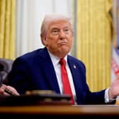 Donald Trump's tariffs make Liz Truss's disastrous UK Budget look positively benign (Picture: Andrew Harnik)