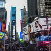Pedestrians and cars move through the Times Square district of Manhattan, New York. Picture: Charly Triballeau/AFP via Getty Images