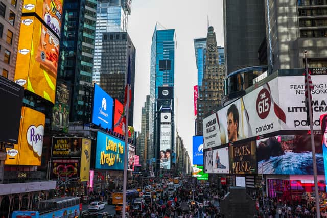 Pedestrians and cars move through the Times Square district of Manhattan, New York. Picture: Charly Triballeau/AFP via Getty Images
