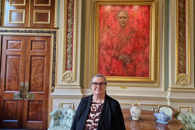 Master of the Drapers' Company Morag Shiach beside Jonathan Yeo's portrait of King Charles