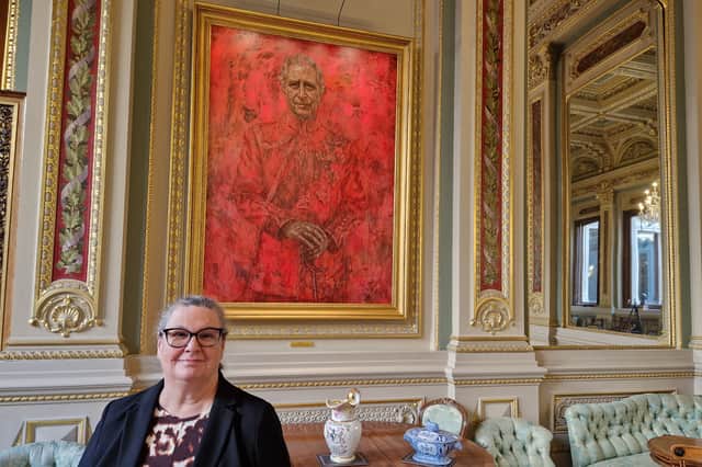Master of the Drapers' Company Professor Morag Shiach beside Jonathan Yeo's portrait of King Charles