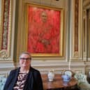 Master of the Drapers' Company Professor Morag Shiach beside Jonathan Yeo's portrait of King Charles