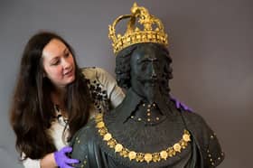 Portia Tremlett, Public Programme Engagement officer for the Novium Museum, looks at the original Market Cross sculpture, a bust of King Charles I by Hubert Le Sueur, at its original home in Chichester, on loan from Tate Britain in 2019