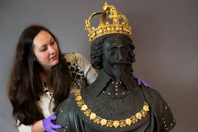 Portia Tremlett, Public Programme Engagement officer for the Novium Museum, looks at the original Market Cross sculpture, a bust of King Charles I by Hubert Le Sueur, at its original home in Chichester, on loan from Tate Britain in 2019