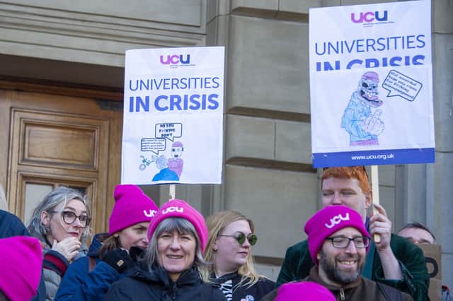 Protesters rally outside Caird Hall in Dundee in February over plans to cut hundreds of jobs at the city's university