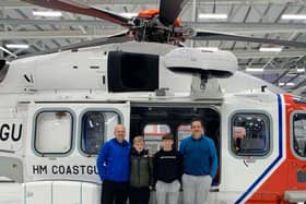 Scott and Frankie Rayner with Jack and Bruce Marbrow after being rescued by the HM Coastguard 