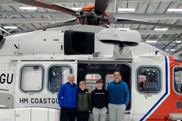 Scott and Frankie Rayner with Jack and Bruce Marbrow after being rescued by the HM Coastguard 