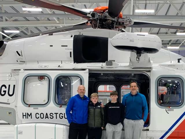 Scott and Frankie Rayner with Jack and Bruce Marbrow after being rescued by the HM Coastguard 
