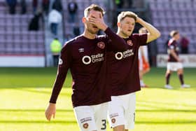 Hearts' Jamie McCart (L) and Blair Spittal look dejected at full time after the 1-0 defeat to Dundee United at Tynecastle. (Photo by Mark Scates / SNS Group)