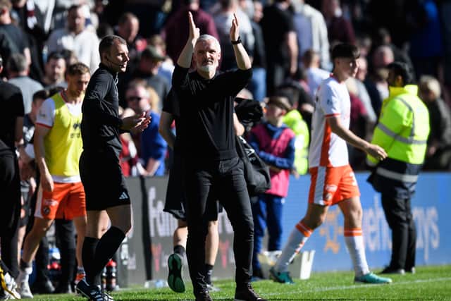Dundee United manager Jim Goodwin applauds the travelling fans at full-time after the 1-0 win over Hearts at Tynecastle. (Photo by Ross Parker / SNS Group)