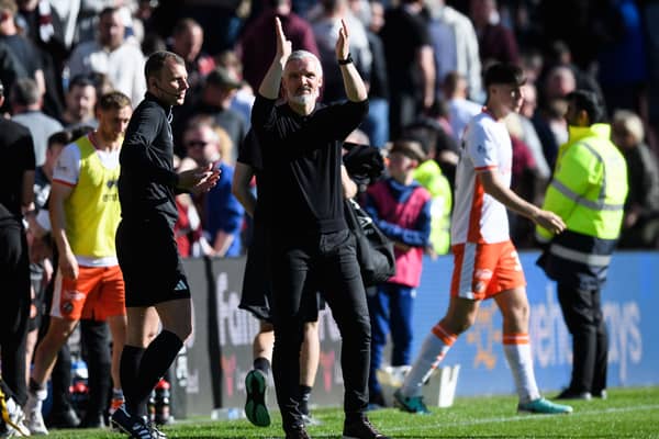 Dundee United manager Jim Goodwin applauds the travelling fans at full-time after the 1-0 win over Hearts at Tynecastle. (Photo by Ross Parker / SNS Group)