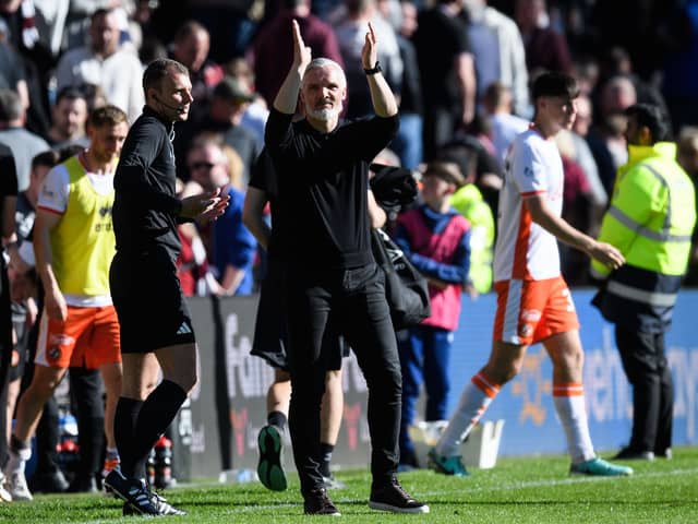 Dundee United manager Jim Goodwin applauds the travelling fans at full-time after the 1-0 win over Hearts at Tynecastle. (Photo by Ross Parker / SNS Group)