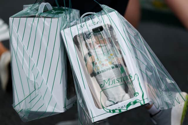Masters gnomes are carried by a ptron at Augusta National Golf Club