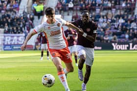 Dundee United debutant Sam Cleall-Harding holds off Hearts forward Elton Kabangu during the match at Tynecastle. (Photo by Ross Parker / SNS Group)