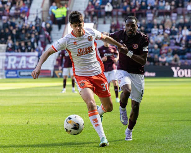 Dundee United debutant Sam Cleall-Harding holds off Hearts forward Elton Kabangu during the match at Tynecastle. (Photo by Ross Parker / SNS Group)