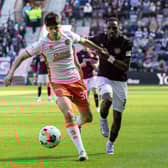 Dundee United debutant Sam Cleall-Harding holds off Hearts forward Elton Kabangu during the match at Tynecastle. (Photo by Ross Parker / SNS Group)