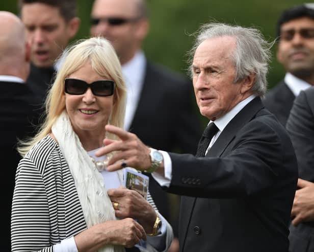 Sir Jackie Stewart and his wife Helen following the funeral of Justin Wilson at St James the Great Church in Northamptonshire in 2015