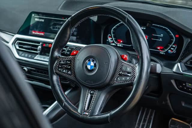The interior features all the premium BMW touches