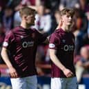 Hearts forward James Wilson (right) is consoled by team-mate Blair Spittal following his red card against Dundee United. (Photo by Mark Scates / SNS Group)