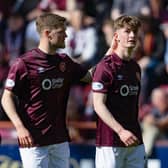 Hearts forward James Wilson (right) is consoled by team-mate Blair Spittal following his red card against Dundee United. (Photo by Mark Scates / SNS Group)