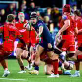 Edinburgh's Darcy Graham is challenged by Cardiff players at the Hive Stadium, on October 19, 2024. (Photo by Ewan Bootman / SNS Group)