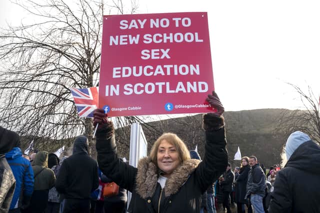 A protestor outside the Scottish Parliament
