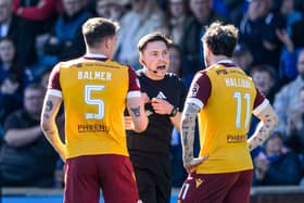Referee Matthew MacDermaid checks the VAR monitor before sending off Motherwell's Kofi Balmer during the match against Kilmarnock at Rugby Park. (Photo by Craig Foy / SNS Group)