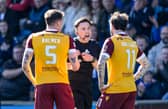 Referee Matthew MacDermaid checks the VAR monitor before sending off Motherwell's Kofi Balmer during the match against Kilmarnock at Rugby Park. (Photo by Craig Foy / SNS Group)