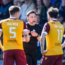 Referee Matthew MacDermaid checks the VAR monitor before sending off Motherwell's Kofi Balmer during the match against Kilmarnock at Rugby Park. (Photo by Craig Foy / SNS Group)