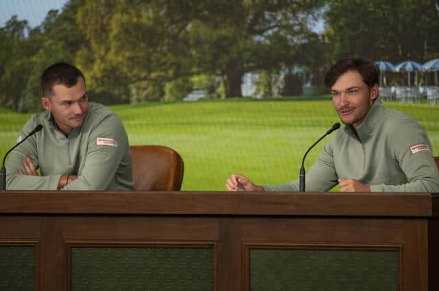 Rasmus Hojgaard , right, speaks to members of the media in a pre-event press conference at Augusta National as his twin brother Nicolai looks on