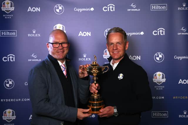 DP World Tour CEO Guy Kinnings and European Ryder Cup captain Luke Donald pose with the Ryder Cup