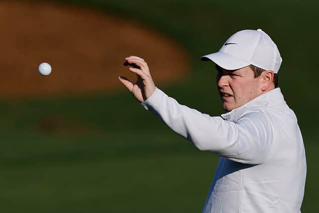 Bob MacIntyre catches a ball on the practice area prior to the 2025 Masters Tournament at Augusta National Golf Club