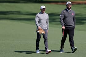 Rory McIlroy and Jon Rahm walk on the second hole during a practice round on Wednesday prior to the 2025 Masters Tournament at Augusta National Golf Club 