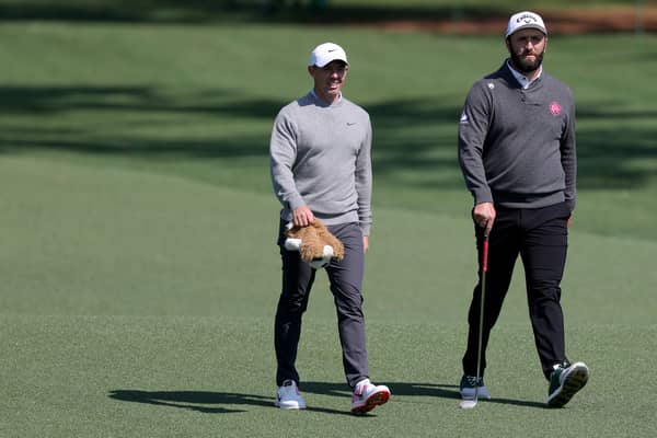 Rory McIlroy and Jon Rahm walk on the second hole during a practice round on Wednesday prior to the 2025 Masters Tournament at Augusta National Golf Club 