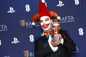 Ben Starr poses in the winners room with the Debut Game Award for 'Balatro' during the BAFTA Games Awards 2025.