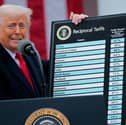 President Donald Trump holds up a chart of ‘reciprocal tariffs’ during his trade announcement event in the Rose Garden at the White House