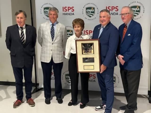 Lewine Mair pictured receiving the PGA of America Lifetime Achievement Award in Journalism from  PGA of America president Don Rea jnr. Also pictured are Mair's Global Golf Post colleagues John Hopkins and Ron Green jnr as well as Jim Nugent, the digital publication's publisher