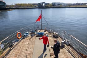 The Princess Royal onboard TS Queen Mary with Iain Sim, chairman of the Friends of TS Queen Mary