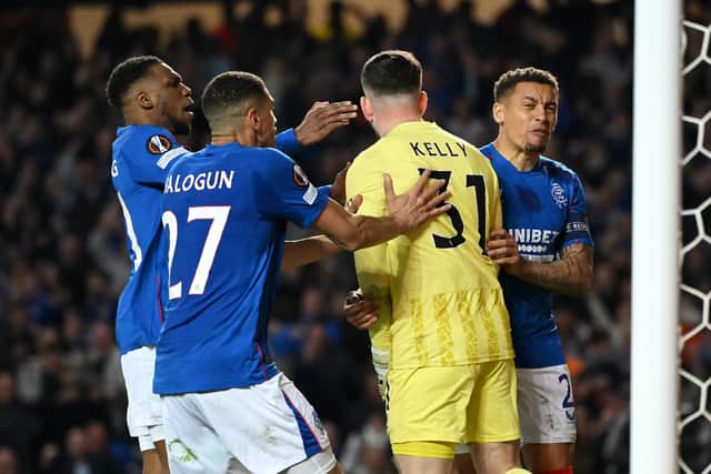 Liam Kelly of Rangers is congratulated by teammates after saving a penalty from Alex Berenguer of Athletic Club