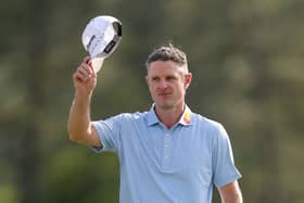 Justin Rose acknowledges the patrons after securing the first-round lead in the 89th Masters at Augusta National Golf Club 