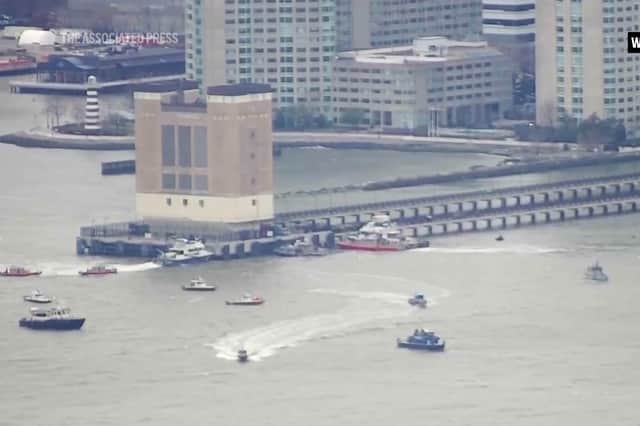 An aerial image taken from video shows rescue vessels on site of helicopter crash on the Hudson River in New York