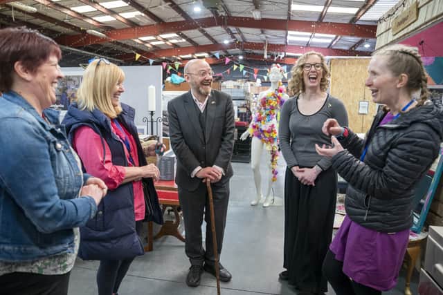 Scottish Green co-leaders Patrick Harvie and Lorna Slater talk to staff at the Stirling Reuse Hub.