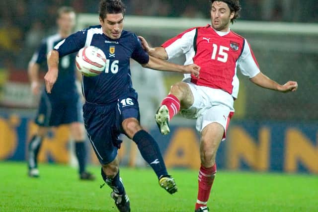 Liverpool sporting director Richard Hughes, left, was capped five times by Scotland.