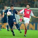 Liverpool sporting director Richard Hughes, left, was capped five times by Scotland.