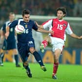 Liverpool sporting director Richard Hughes, left, was capped five times by Scotland.