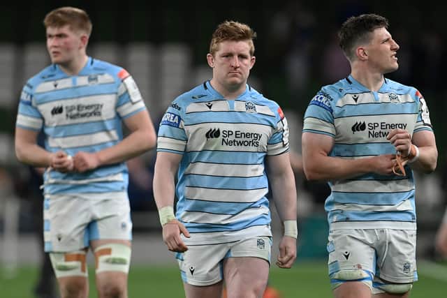 Dejection for Euan Ferrie, Johnny Matthews and Rory Darge of Glasgow Warriors after the heavy defeat by Leinster in the Investec Champions Cup quarter-final in Dublin.