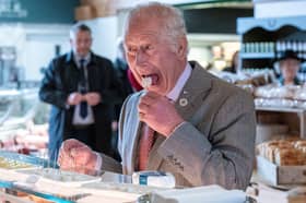 King Charles tries a sheep's milk cheese called Love Ewe at Tebay Services on the southbound carriageway of the M6 (Picture: Arthur Edwards)